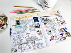 an open planner with pencils and coffee mug on the table next to it,