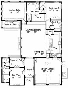 the first floor plan for a home with two master suites and an open kitchen area