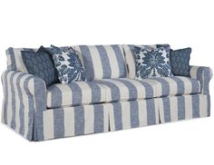 a striped couch with blue and white pillows