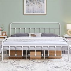 a white metal bed frame with two drawers under the headboard and foot board, in a bedroom