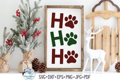 an image of a christmas scene with deer and dog paw prints on the wall next to pine cones