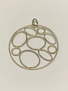 Vintage Unique Sterling Silver Large Circle Bubble Pendant. This pendant is 3 inches in length, 2 1/2 inches in width, and weighs a total of 14.43 grams. The pendant is tested and stamped sterling silver; it is also stamped with a hallmark that we could not figure out the designer to. This pre-owned vintage pendant is in good condition and is ready to be worn! Willing to answer any questions and send more pictures if requested, please feel free to ask! Please come check out other stunning unique Circle Jewelry, Vintage Pendant, Silver Pendants, 925 Jewelry, Vintage Silver, Pendant Necklaces, Jewelry Inspiration, Silver Pendant, Jewelry Pieces