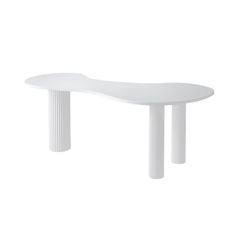 a white table sitting on top of a white floor