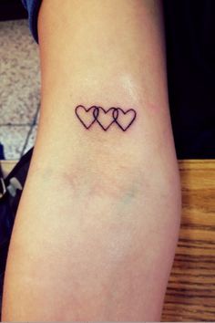 two hearts tattoo on the ankle