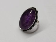 This Gorgeous Amethyst gems stone Ring, features a Boho Studded Pattern around the Genuine Cognac Color purple  Cabochon. The Border is lightly oxidized to show details and looks lovely with the Amethyst gemstone. All my gemstones are hand selected for best quality assurance, then precisely sawed, and shaped into the desired geometry. The precious stones are then delicately grinned, sanded and hand polished to make sure the jewelry have the perfect aesthetic. Amethyst Gemstone Ring, 92.5 Sterlin