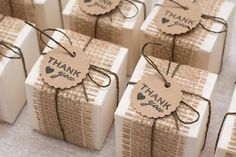 small gift boxes tied with twine and tag that says thank you on the top