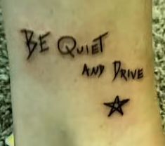 a tattoo saying be quiet and drive with stars on it