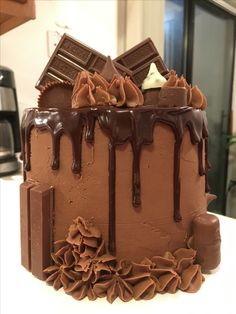 a cake with chocolate icing and drizzles on it