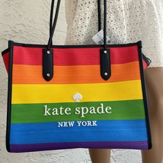 Beautiful Nwt Kate Spade Xl Tote All Love Pride Multi Rainbow Ella Yellow Blue Price Is Firm, Price Is Non - Negotiable New With Tag Authentic 12.13"H X 19.8" (Top), 15.4" (Bottom)W X 8.8"D Dual Rounded Handles Drop Length: 11.25" Kate Spade Multicolor Spring Bags, Trendy Multicolor Kate Spade Bag, Kate Spade Multicolor Travel Bag, Kate Spade Multicolor Tote Bag, Kate Spade Yellow Shopping Bag, Yellow Kate Spade Shopping Bag, Kate Spade Coat, Large Leather Handbags, Rainbow Accessories