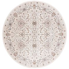 a round rug with an intricate design on the center and sides, in beige tones