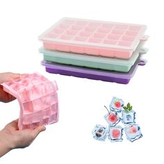 three ice cube trays and one is filled with watermelon slices