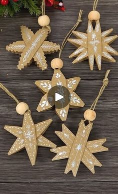 wooden ornaments are hanging on a table