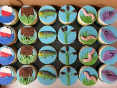 cupcakes decorated with different types of bugs and fish on top of each other