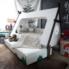 a child's bedroom with a bed made to look like a tent