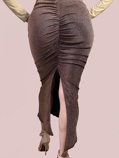 ✨ Shimmering metallic brown fabric with ruched back split for flair and movement.💃 Perfect for Parties and Milongas. Designed to highlight your curves and accentuate your silhouette for an alluring look on the dance floor. High Stretch for a comfortable and flexible fit, ensuring you can move with grace and confidence, this skirt is a true embodiment of elegance and sophistication. Handcrafted with precision and attention to detail, this tango skirt is a must-have addition to any dancer's wardr Party Stretch Gathered Skirt, Party Bottoms With Ruched Sides And Stretch, Stretch Party Bottoms With Ruched Sides, Metallic Stretch Skirt For Party, Fitted Brown Ruched Bottoms, Elegant Party Bottoms With Ruched Sides, Metallic Skirt For Evening, Metallic Long Skirt For Party, Gold Long Skirt For Night Out