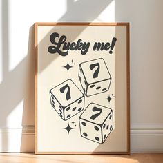 a wooden frame with dices on it and the words lucky me written in black