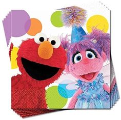 the sesame street characters are posing for a photo with balloons and confetti around them