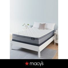 an image of a mattress that is in the middle of a bed with pillows on it