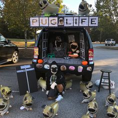 a group of stuffed animals sitting in the back of a truck with words on it