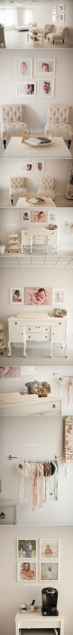 there are many shelves with pictures hanging on the wall above them and below it is a computer desk