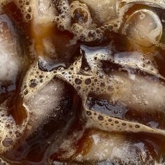 ice cubes with brown and white liquid in them