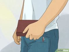 a person holding a wallet in their left hand while wearing blue jeans and a white t - shirt