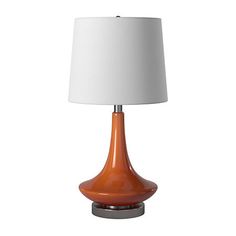 an orange table lamp with a white shade