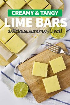 lime bars on a cutting board with lemon wedges