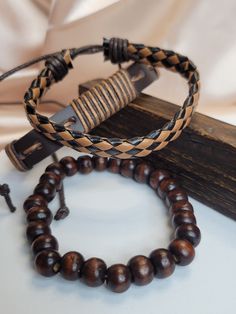 "Upgrade your style with our Leather Beaded Men Bracelet Set. These bracelets combine the rugged charm of genuine leather with stylish beads, creating a versatile accessory that adds a touch of masculinity to any outfit. Perfect for everyday wear or special occasions, they make a great addition to any man's wardrobe.  set SHIPPING ♥All orders will be shipped out within 1- 2 business days after the order has been received. Please double check the address is correct before checking out. ♥All of ou Casual Brown Braided Bracelets With Round Beads, Brown Leather Beaded Bracelets With Round Beads, Casual Brown Leather Beaded Bracelets, Moda Hippie, Wrist Cuffs, Men's Wardrobe, Bead Leather, Braided Bracelets, Bracelet Set