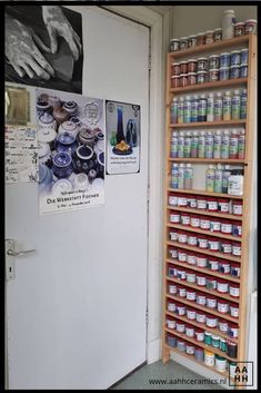 there are many cans and containers on the wall