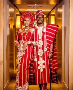 two people are dressed in red and white outfits