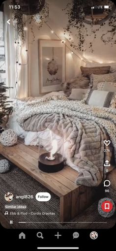 a bed with blankets, pillows and lights on the headboard is shown in an instagram