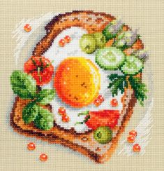 a cross stitch picture of an egg on toast with tomatoes, peppers and cucumbers