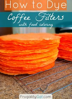 an orange cake sitting on top of a counter next to a cooling rack with the words how to dye coffee filters