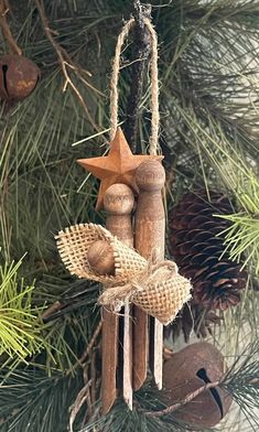 an ornament hanging from a christmas tree decorated with wood and burlocks