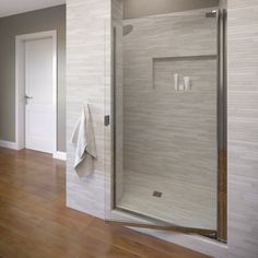 a bathroom with a glass shower door and wood flooring on the side of the room