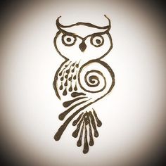 an owl drawn in black ink on a white paper with swirls and spirals