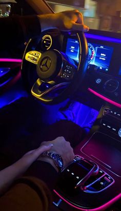 the interior of a car with blue and red lights