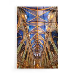 the inside of a cathedral with vaulted ceilings and stained glass ceiling lights hanging from the ceiling