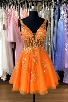 This short homecoming dress features an A-line silhouette and V-neck, with an open back and zipper closure. The tulle material is adorned with floral appliques and the above knee length provides a touch of elegance. All in a striking orange color. SKU: 3556 Orange color Tulle material A-line silhouette V neck Floral appliques Above knee length Open back with zipper Ship in 7-10 business days Size: US 2-16. We offer free returns in 7 days. Please refer to our return policy page for more details. Orange And Pink Homecoming Dress, Orange Fall Dresses, Neon Orange Hoco Dress, Neon Homecoming Dresses, Orange Hoco Dress, Short Orange Dress, Senior Hoco, Tea Length Cocktail Dresses, Orange Homecoming Dresses