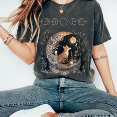 This comfort colors witchy fox shirt is perfect for goblincore lovers, witchy aesthetic lovers and those who love dark cottagecore. This shirt features original watercolor art created by me - so you won't be able to get this design anywhere else. 🔮YOUR TEE🔮 🌙 Cozy, plush 100% ring-spun cotton 🌙Relaxed fit 🌙The soft-washed, garment-dyed fabric brings extra coziness to your wardrobe while the relaxed fit makes it an excellent daily choice. 🌙 Wash and dry as normal (preferably a cool cycle). Witchy Shirts Casual, Fall Witchy Vibes Outfit, Cheap Witchy Cotton Tops, Witchy Streetwear, Witchy Wardrobe, Aesthetic Lovers, Fairycore Dark, Witchy Aesthetic, Cottagecore Shirt