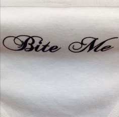 a white cloth with the words bite me on it