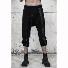 Introducing our avant-garde men's black loose pants, a fusion of style and comfort. Crafted with georgette and faux leather details, these unique pants redefine street fashion for men. Designed below the knee with a short length, these pants exude a dystopian, cyberpunk vibe, perfect for the fashion-forward man. Embrace the allure of the dark side and stand out from the crowd with these extraordinary pants. With three functional pockets - front, back, and side - these pants offer both fashion an Street Fashion For Men, Black Loose Pants, Dystopian Cyberpunk, Steampunk Pants, Rave Outfits Men, Pants Unique, Festival Outfits Men, Unique Pants, High Fashion Men