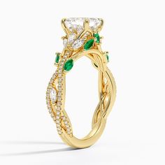 a yellow gold engagement ring with an intricate vine design and round brilliant cut diamonds on the band