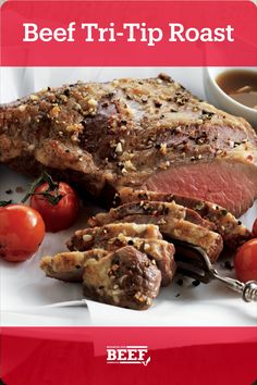 beef tri - tip roast on a plate with tomatoes and garlic