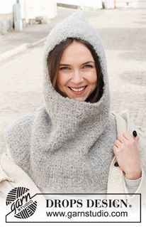 a woman wearing a gray hood and scarf