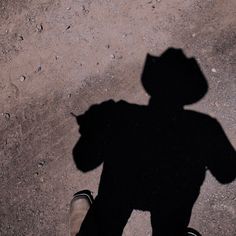 the shadow of a child's head and feet