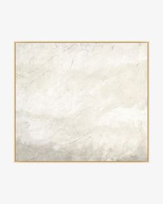 a white marble wall with a gold frame