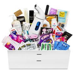 a white box filled with lots of beauty products and personal care items on top of it