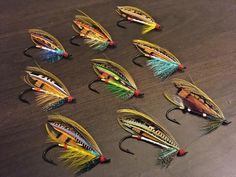 several different types of fishing lures on a table